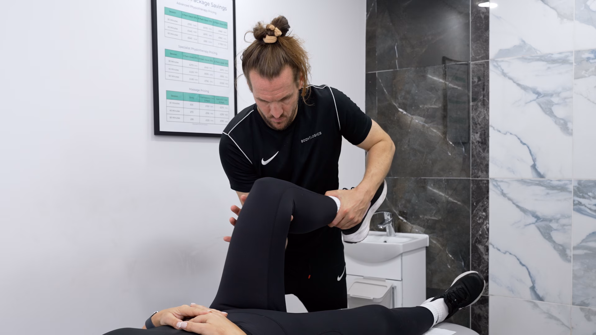 A Bodylogics physiotherapist supporting a patient at home