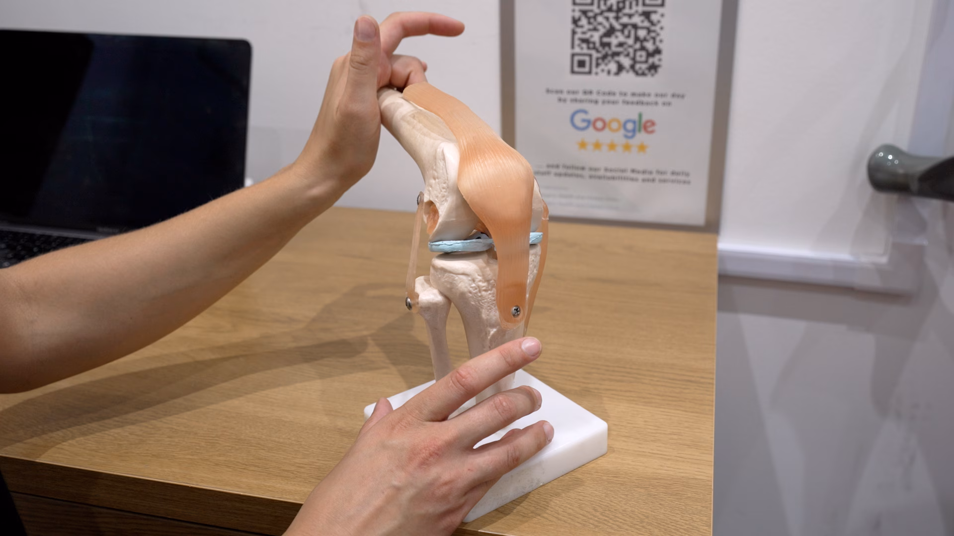 A Bodylogics physiotherapist assessing a patient